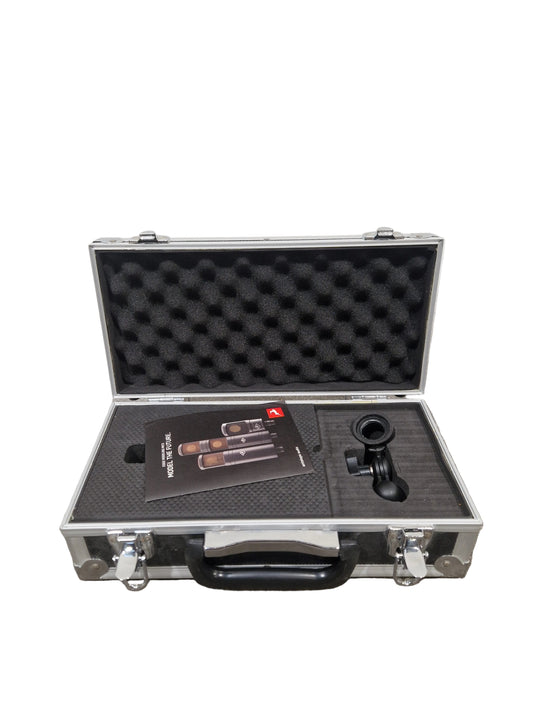 Open tool case with foam interior on a textured surface