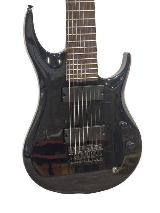 Black electric guitar on a light gray surface
