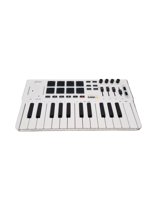 White electronic keyboard on a gray concrete surface
