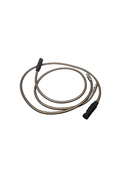 Coiled cable on a textured gray surface