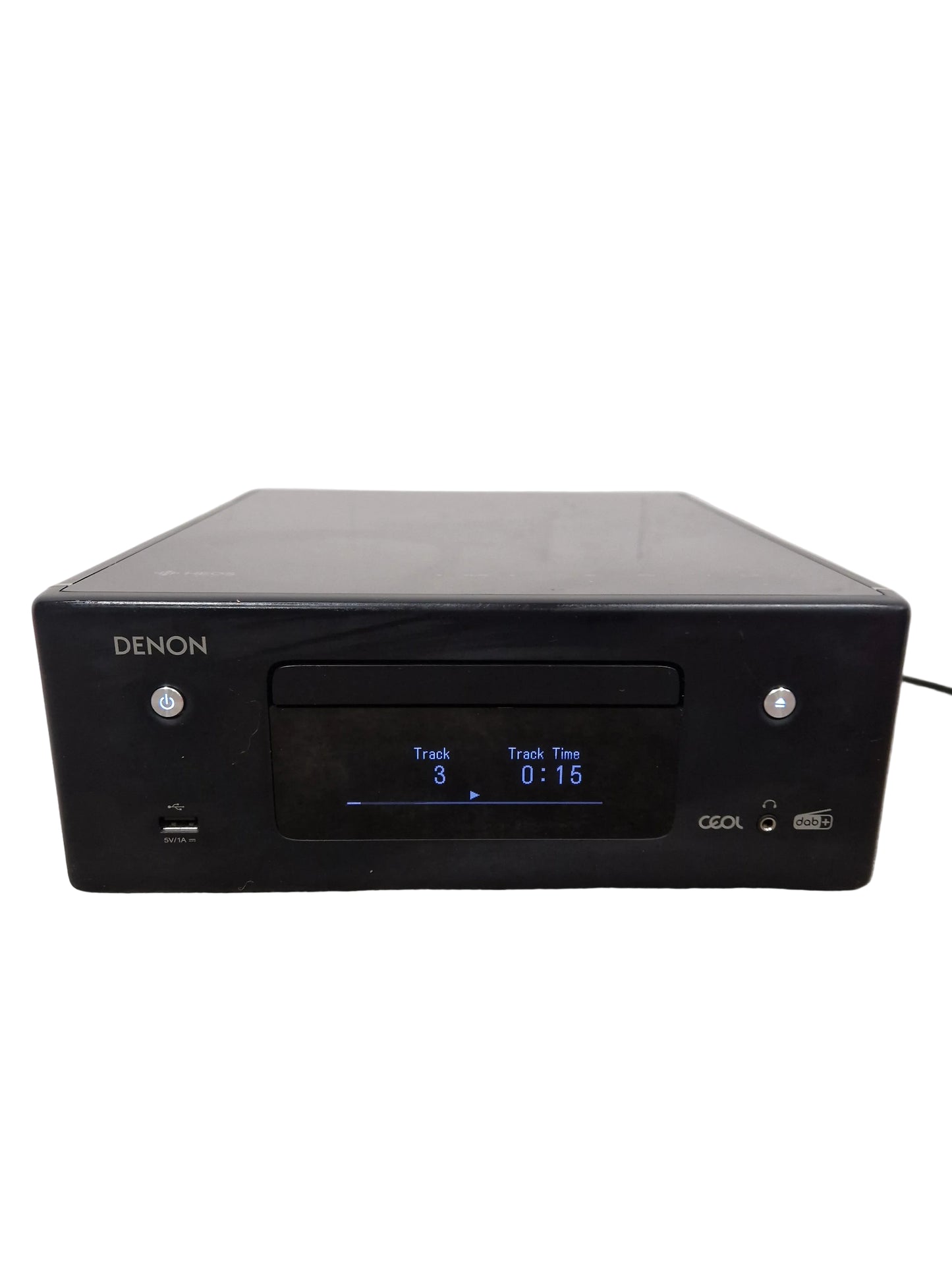 Black Denon audio component on a gray surface