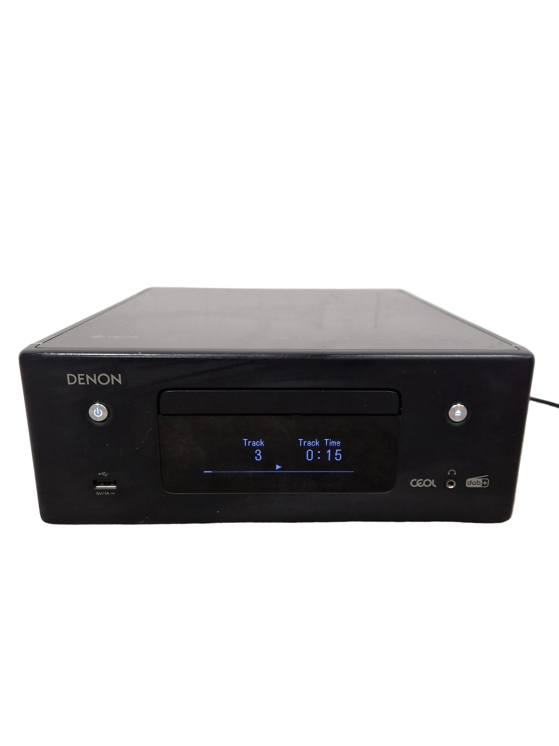 Black Denon audio component on a gray surface