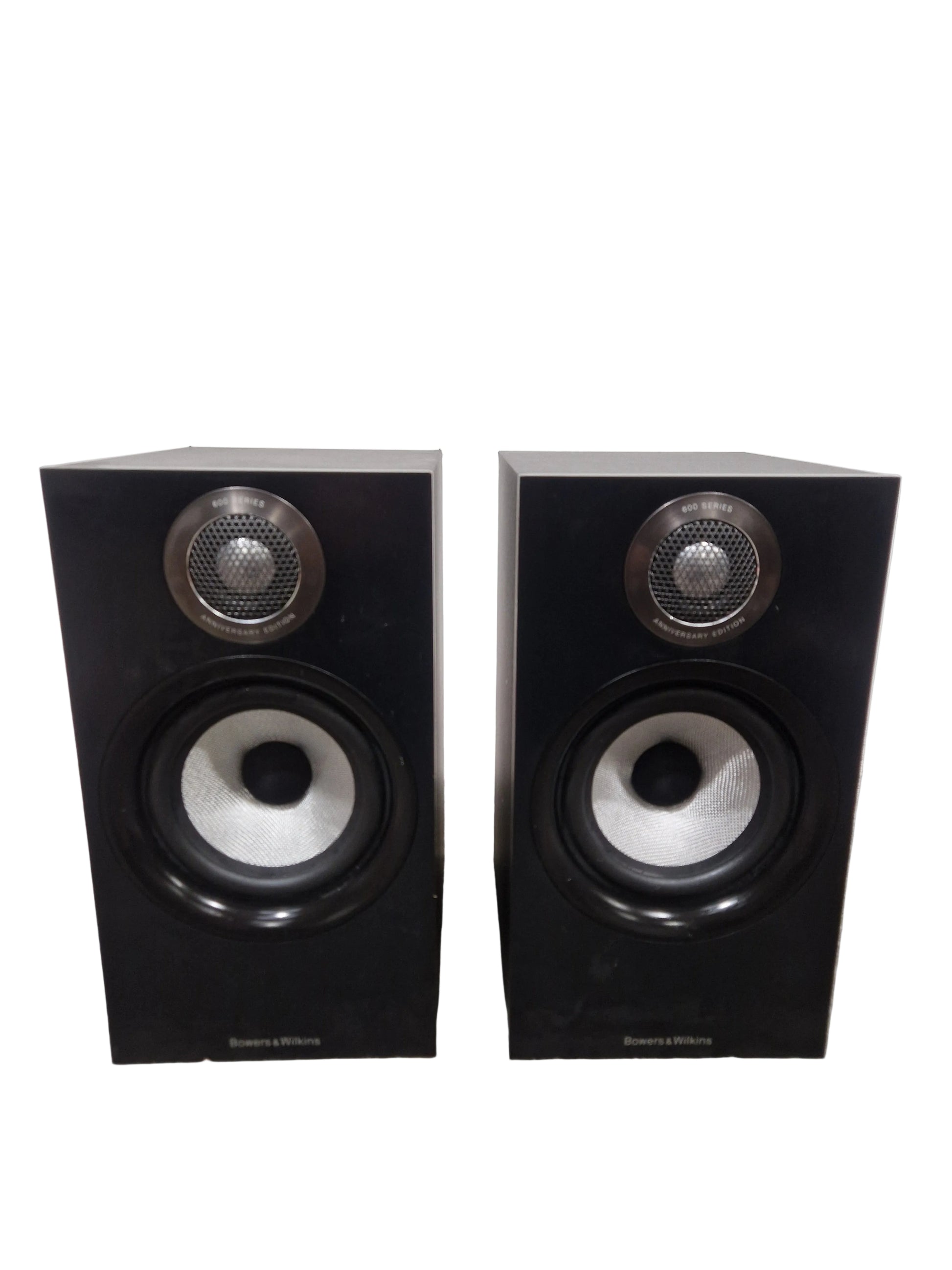 Pair of black speakers on a light gray surface