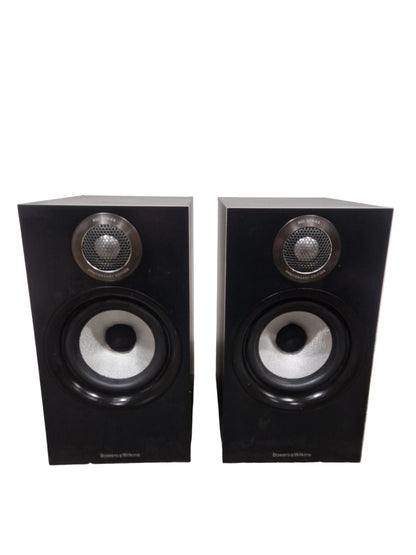 Pair of black speakers on a light gray surface