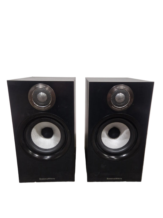 Pair of black speakers on a light gray surface